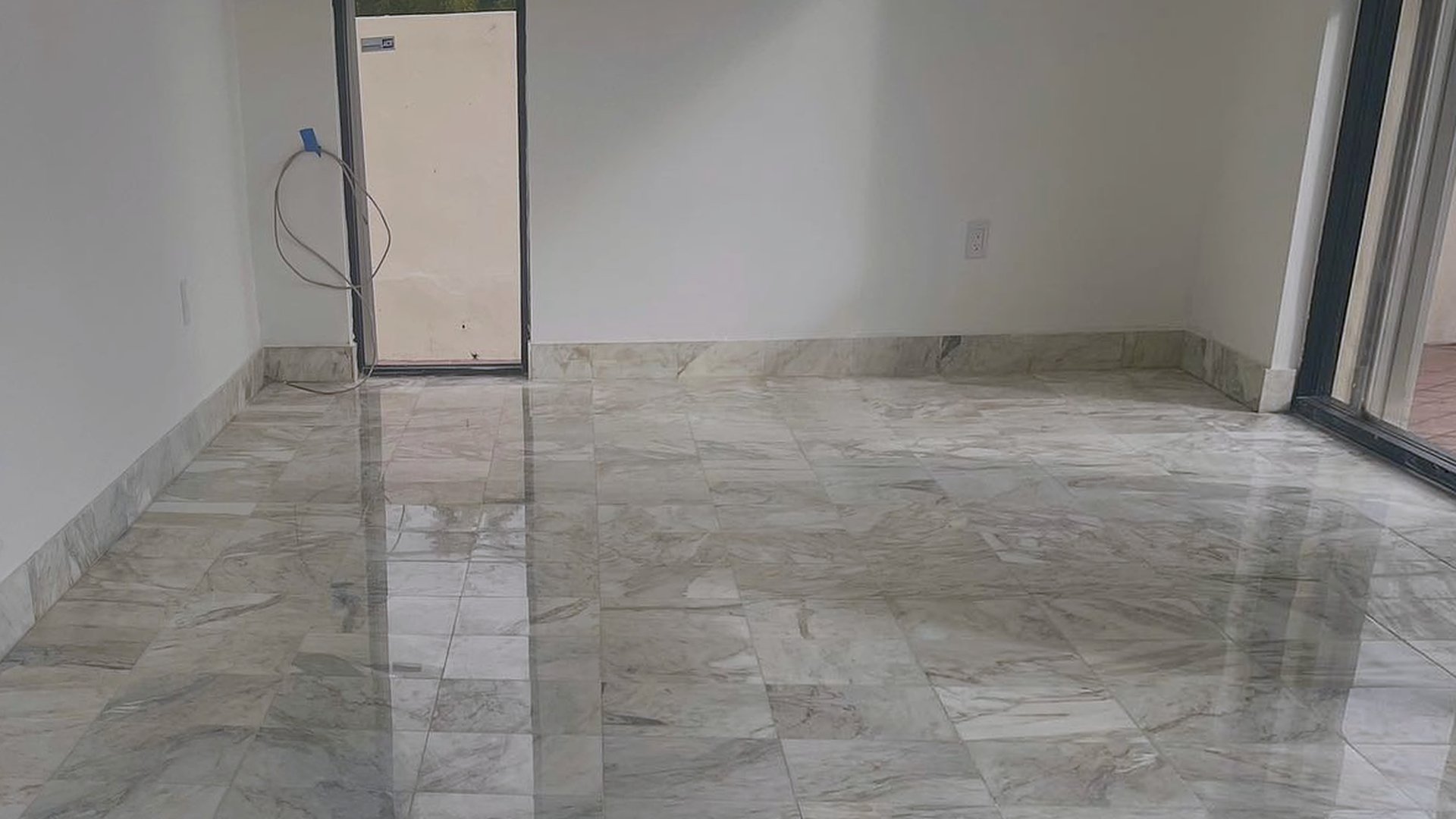 The same marble floor after honing and polishing