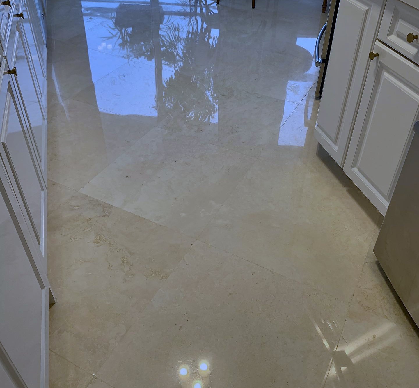 Marble kitchen floor polished to a clear reflection